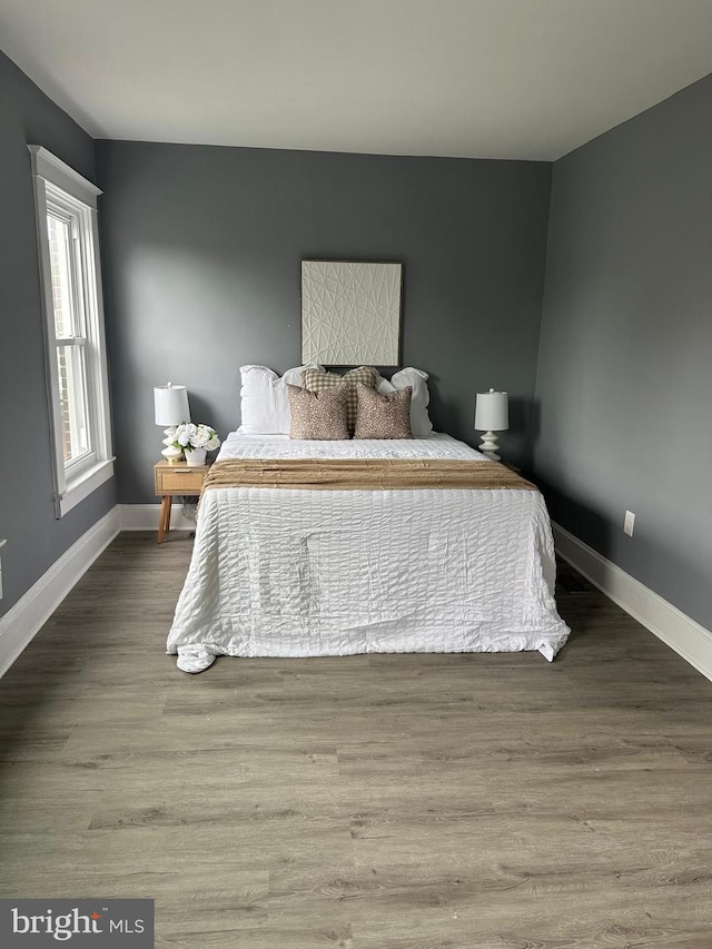 3720 Brooklyn, Baltimore, MD 21225 - bedroom featuring baseboards and wood finished floors