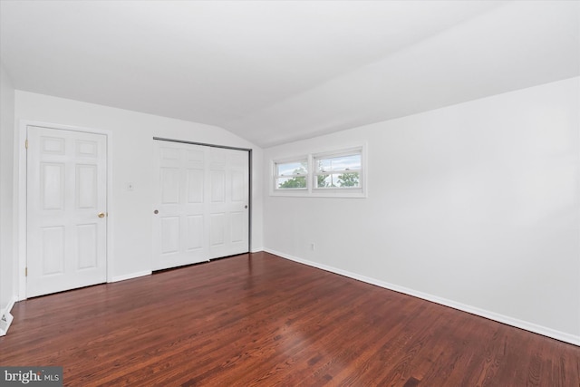 1735 Limestone Rd, Wilmington, DE 19804 - unfurnished bedroom with lofted ceiling, dark wood-style floors, and a closet