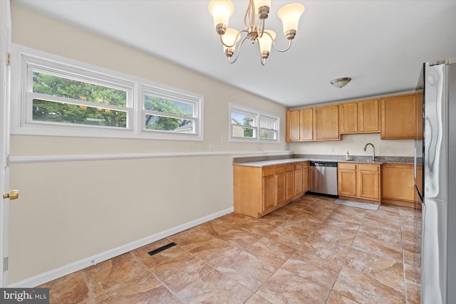 1735 Limestone Rd, Wilmington, DE 19804 - kitchen with appliances with stainless steel finishes, healthy amount of natural light, a chandelier, and hanging light fixtures