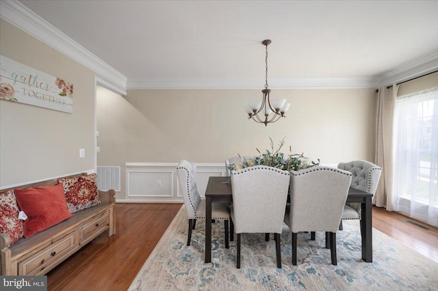 35 Gallery Rd, Stafford, VA 22554 - dining space featuring a chandelier, crown molding, wood finished floors, and a wainscoted wall