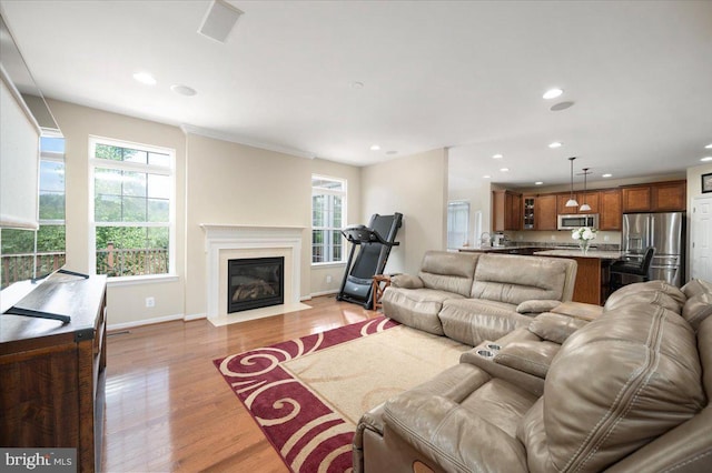 35 Gallery Rd, Stafford, VA 22554 - living area with healthy amount of natural light, recessed lighting, light wood-type flooring, and a fireplace with flush hearth