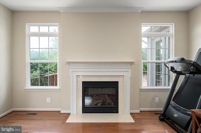 35 Gallery Rd, Stafford, VA 22554 - unfurnished living room featuring wood finished floors, a fireplace with flush hearth, and ornamental molding