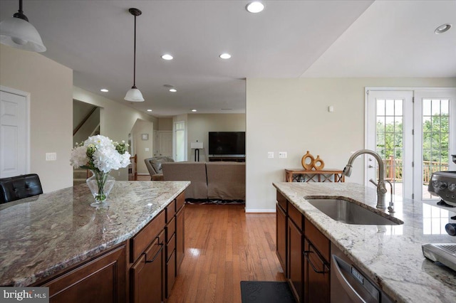 35 Gallery Rd, Stafford, VA 22554 - kitchen featuring stainless steel dishwasher, hardwood / wood-style floors, decorative light fixtures, recessed lighting, and light stone countertops
