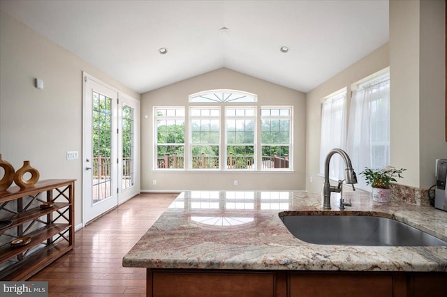 35 Gallery Rd, Stafford, VA 22554 - kitchen with vaulted ceiling, light stone counters, and hardwood / wood-style flooring