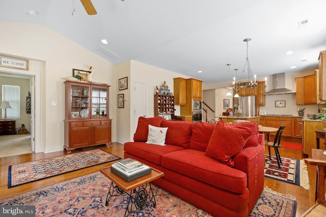 13 Doddington Blvd, Medford, NJ 08055 - living room featuring wood finished floors, a ceiling fan, lofted ceiling, and a chandelier