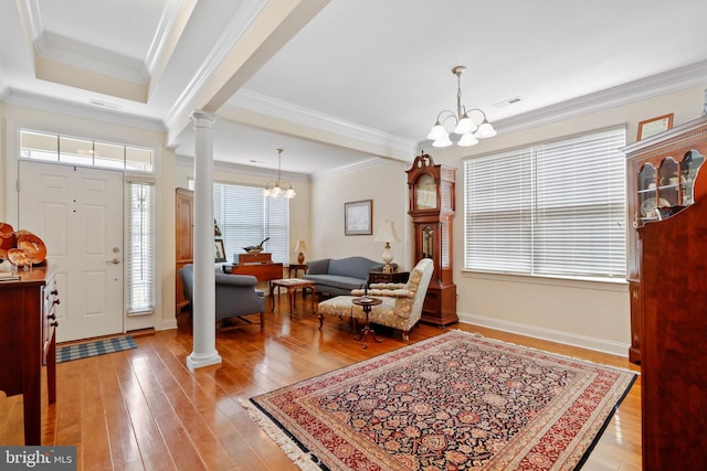 13 Doddington Blvd, Medford, NJ 08055 - entrance foyer with a chandelier, decorative columns, light wood-type flooring, and ornamental molding