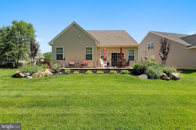 13 Doddington Blvd, Medford, NJ 08055 - rear view of house featuring a lawn, a patio area, and roof with shingles
