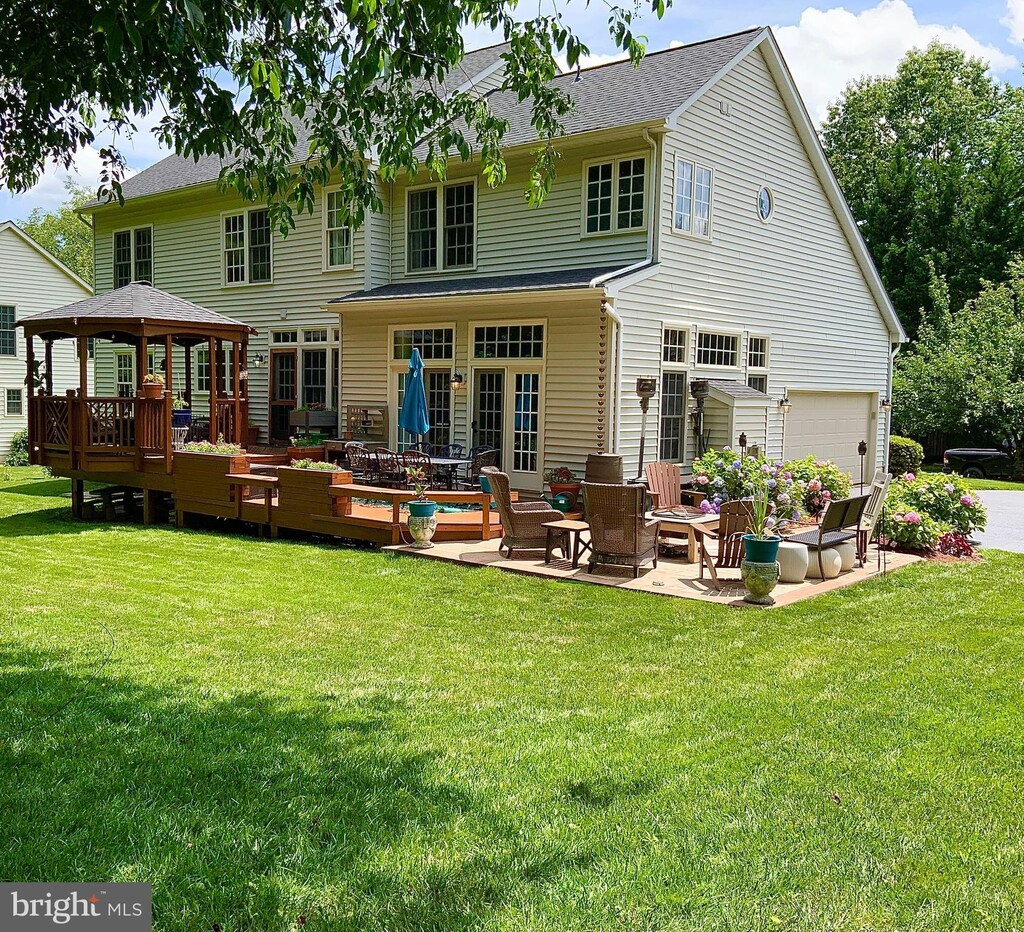 7834 Meadowgate Dr, Manassas, VA 20112 - rear view of property with a gazebo, a yard, and a deck