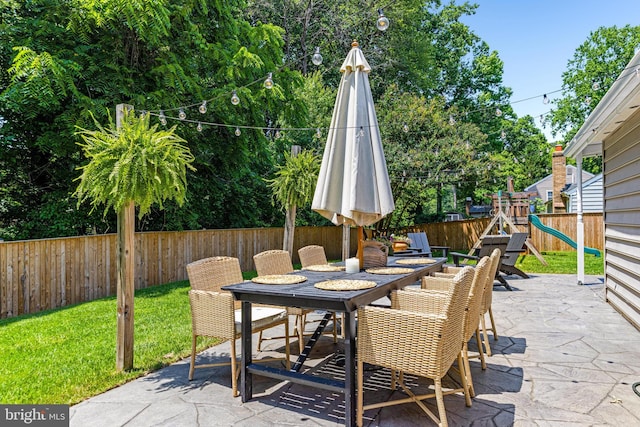 1739 Mayfair Pl, Crofton, MD 21114 - fenced backyard featuring outdoor dining space, a patio, and a playground