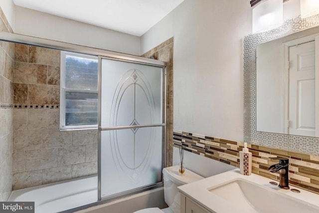 1446 California St, Woodbridge, VA 22191 - full bathroom with vanity, combined bath / shower with glass door, backsplash, and tile walls