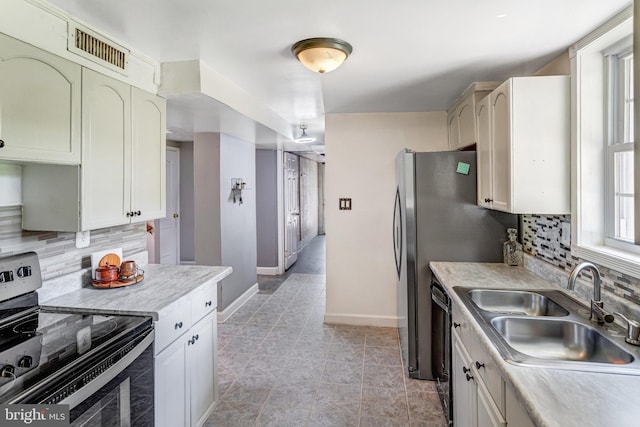 1446 California St, Woodbridge, VA 22191 - kitchen with electric stove, light countertops, tasteful backsplash, and dishwasher