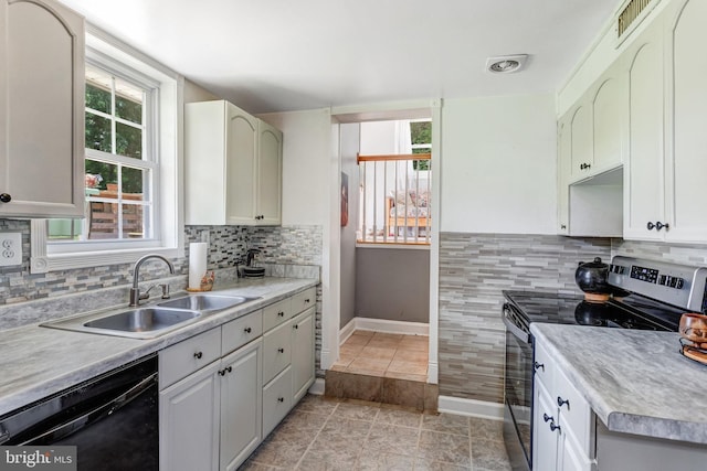 1446 California St, Woodbridge, VA 22191 - kitchen featuring stainless steel electric range, black dishwasher, light countertops, and light tile patterned flooring