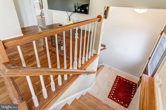 1446 California St, Woodbridge, VA 22191 - stairs with baseboards and marble look tile flooring