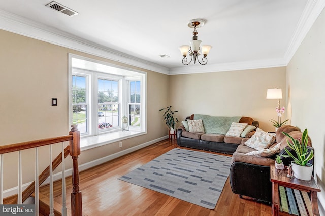 1446 California St, Woodbridge, VA 22191 - living room featuring a chandelier, ornamental molding, and light wood-style floors