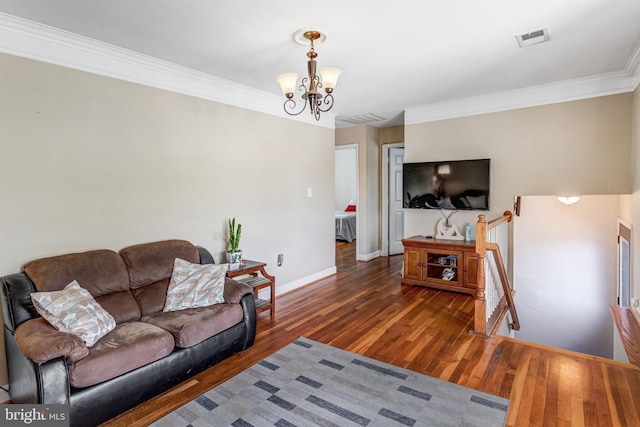 1446 California St, Woodbridge, VA 22191 - living room featuring wood finished floors, a chandelier, and crown molding