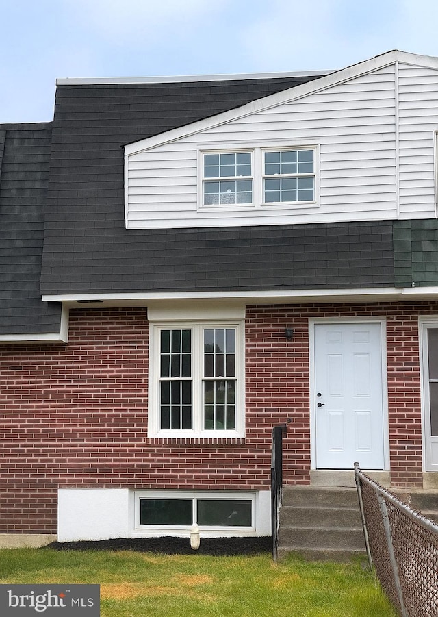 1504 Bonwood Rd, Wilmington, DE 19805 - property entrance featuring brick siding and a shingled roof