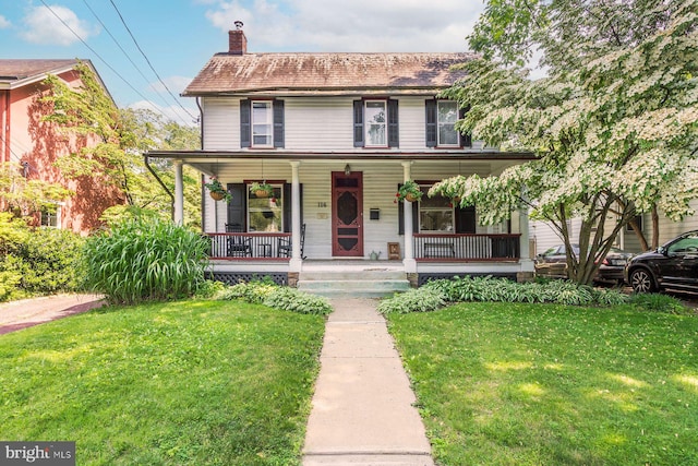 114 E Ashland St, Doylestown, PA 18901 - view of front of house with a chimney, a front yard, and covered porch