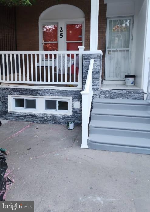25 N 28th St, Camden, NJ 08105 - doorway to property with a porch and stone siding