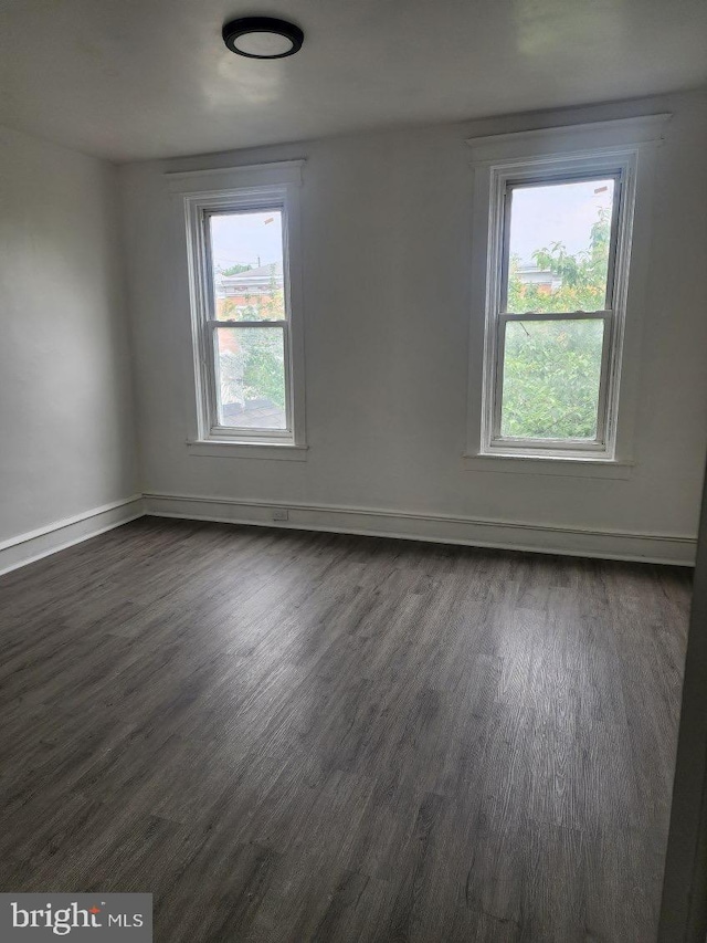 25 N 28th St, Camden, NJ 08105 - empty room featuring dark wood-style flooring and baseboards