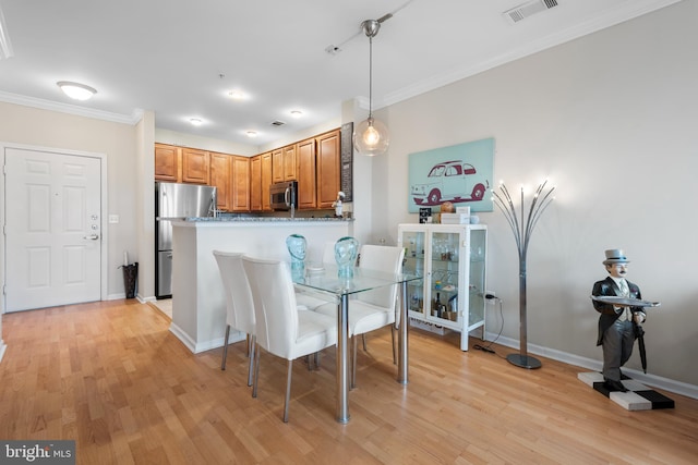 12000 Market St Unit 378, Reston, VA 20190 - dining area with crown molding and light wood-style floors
