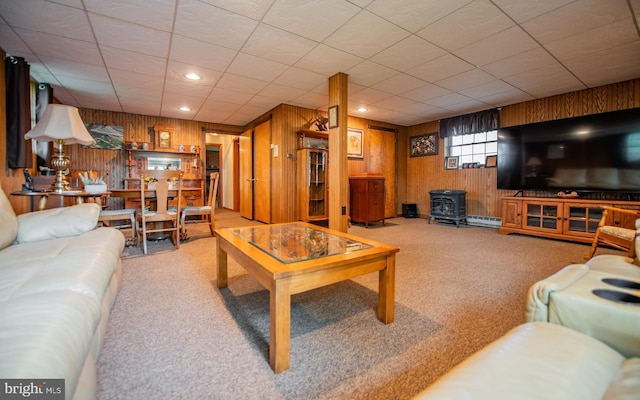 1 Emerald St, Mill Hall, PA 17751 - living room featuring wood walls, carpet floors, a wood stove, and recessed lighting