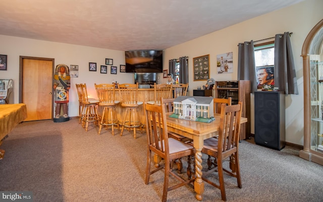 1 Emerald St, Mill Hall, PA 17751 - carpeted dining space featuring a dry bar and a textured ceiling