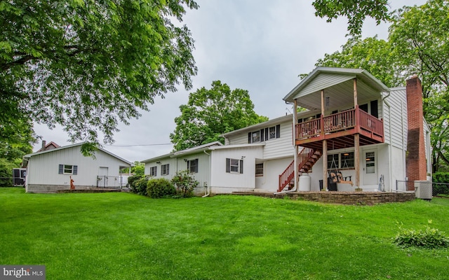 1 Emerald St, Mill Hall, PA 17751 - rear view of house featuring a chimney, stairs, and a deck