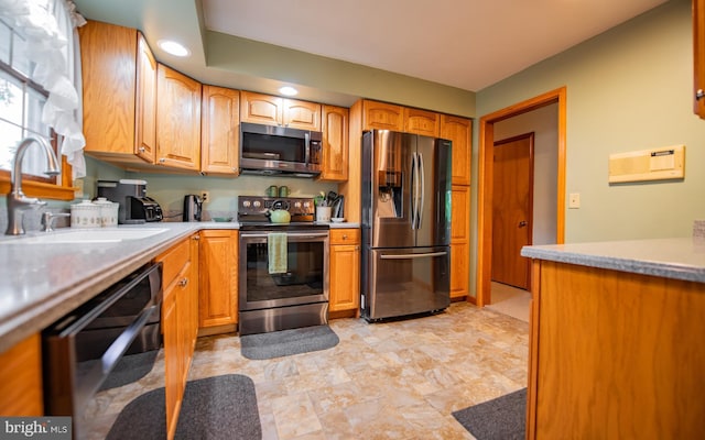 1 Emerald St, Mill Hall, PA 17751 - kitchen with stainless steel appliances, light countertops, recessed lighting, and brown cabinets