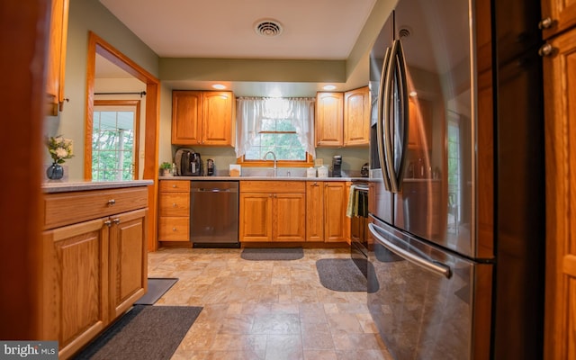 1 Emerald St, Mill Hall, PA 17751 - kitchen with stainless steel appliances, light countertops, plenty of natural light, and stone finish flooring