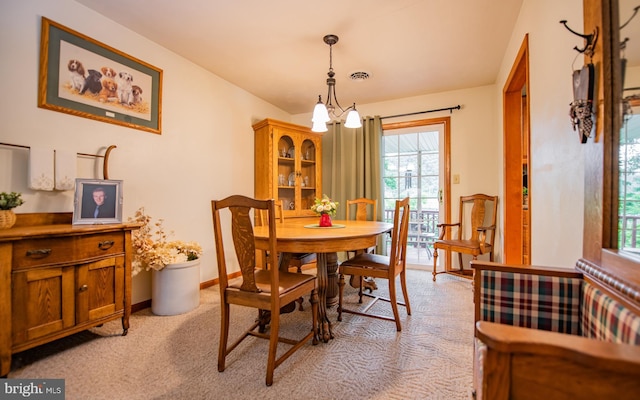 1 Emerald St, Mill Hall, PA 17751 - dining room with light colored carpet, plenty of natural light, and a chandelier