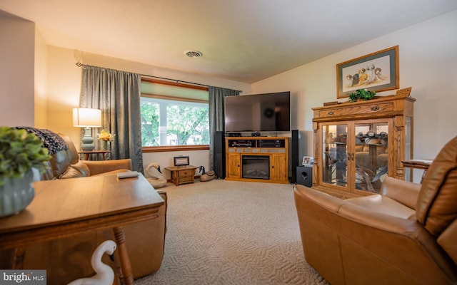 1 Emerald St, Mill Hall, PA 17751 - carpeted living room with a glass covered fireplace