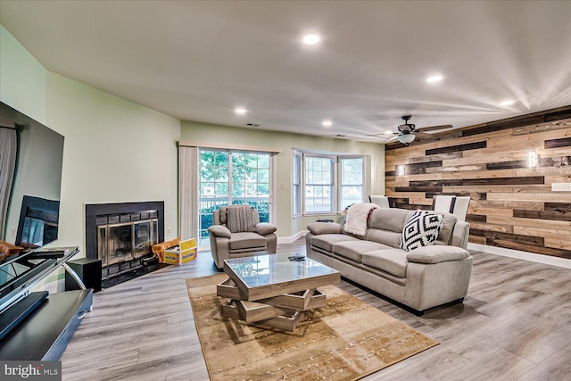 108 Wrangel Ct Unit 1, Princeton, NJ 08540 - living area featuring wood walls, light wood-type flooring, a fireplace, recessed lighting, and a ceiling fan