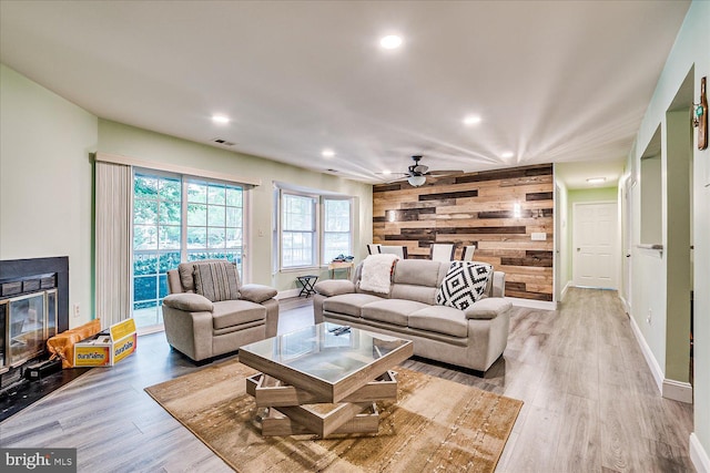 108 Wrangel Ct Unit 1, Princeton, NJ 08540 - living room featuring wood walls, wood finished floors, ceiling fan, recessed lighting, and a glass covered fireplace