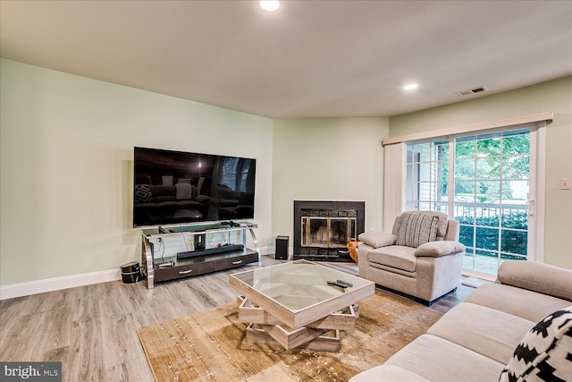 108 Wrangel Ct Unit 1, Princeton, NJ 08540 - living area with wood finished floors, a glass covered fireplace, and recessed lighting