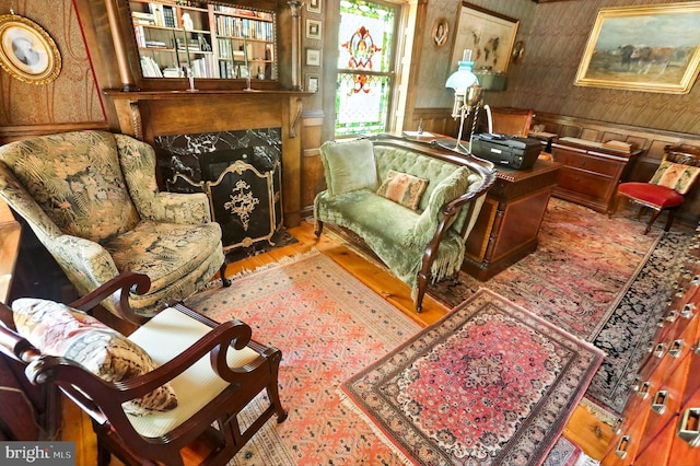 1722 Swamp Pike, Gilbertsville, PA 19525 - living area with wood finished floors, a wainscoted wall, and wallpapered walls