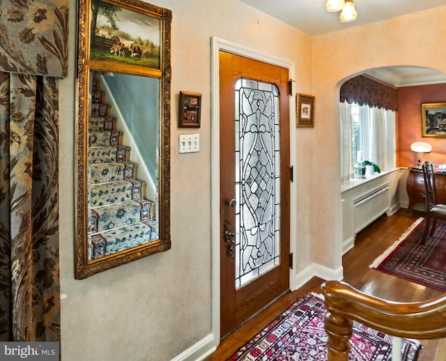 1722 Swamp Pike, Gilbertsville, PA 19525 - foyer entrance featuring arched walkways, wood finished floors, and crown molding