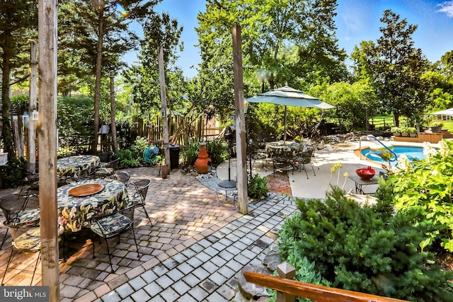 1722 Swamp Pike, Gilbertsville, PA 19525 - view of patio with an outdoor pool and view of wooded area