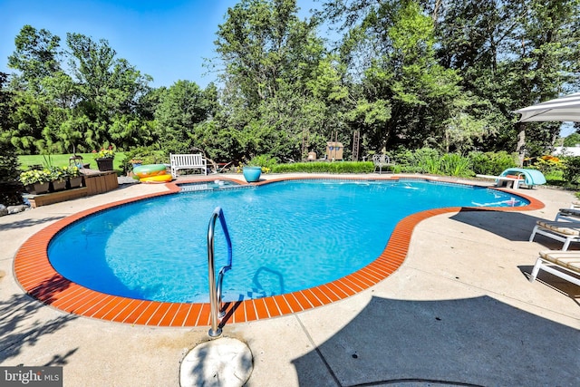 1722 Swamp Pike, Gilbertsville, PA 19525 - outdoor pool with a patio area and view of scattered trees