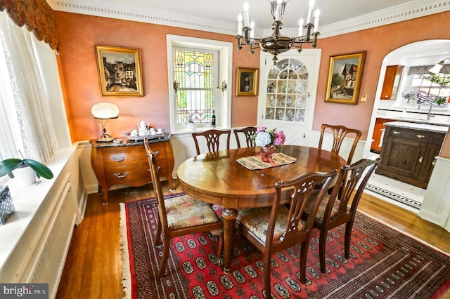 1722 Swamp Pike, Gilbertsville, PA 19525 - dining area with wood finished floors, a chandelier, and ornamental molding