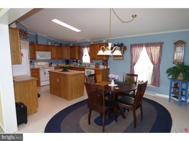277 W 4th St, Red Hill, PA 18076 - dining space with vaulted ceiling, crown molding, a chandelier, plenty of natural light, and light flooring