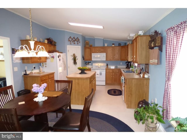 277 W 4th St, Red Hill, PA 18076 - kitchen with white appliances, lofted ceiling, crown molding, light countertops, and a chandelier