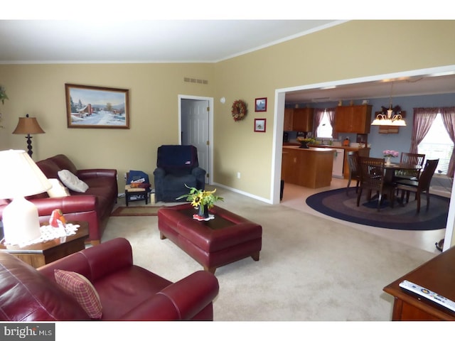 277 W 4th St, Red Hill, PA 18076 - living room featuring ornamental molding, light carpet, and a chandelier