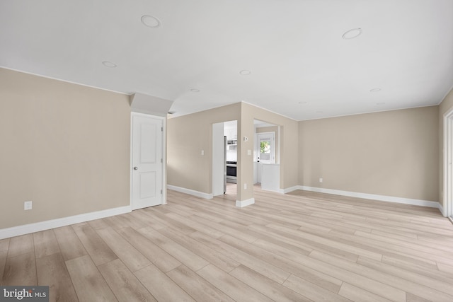 116 Hollow Rd, Levittown, PA 19056 - unfurnished living room with light wood-style flooring and recessed lighting