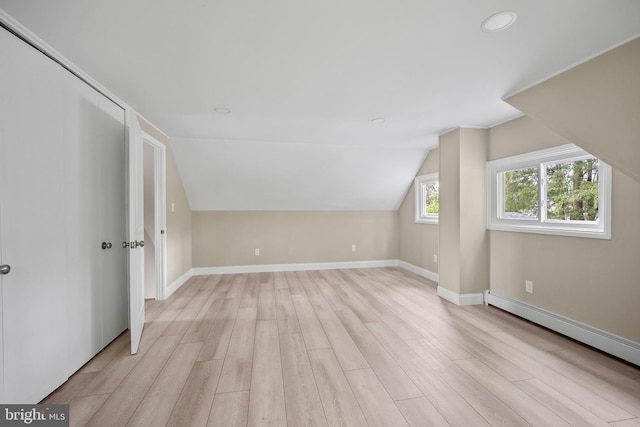 116 Hollow Rd, Levittown, PA 19056 - additional living space with a baseboard radiator, light wood-type flooring, lofted ceiling, and recessed lighting