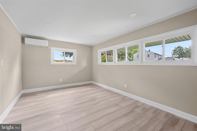 116 Hollow Rd, Levittown, PA 19056 - unfurnished room with a wall mounted air conditioner, light wood-type flooring, and recessed lighting