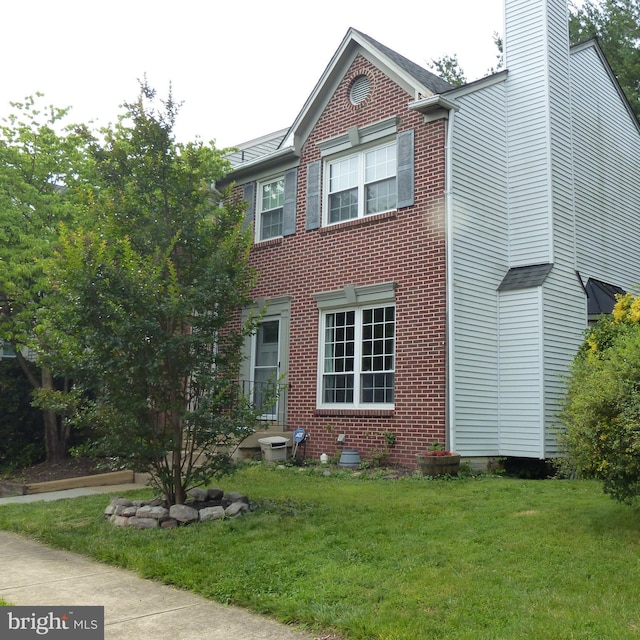 732 Balls Bluff Rd NE, Leesburg, VA 20176 - view of front facade with a front yard, a chimney, and brick siding