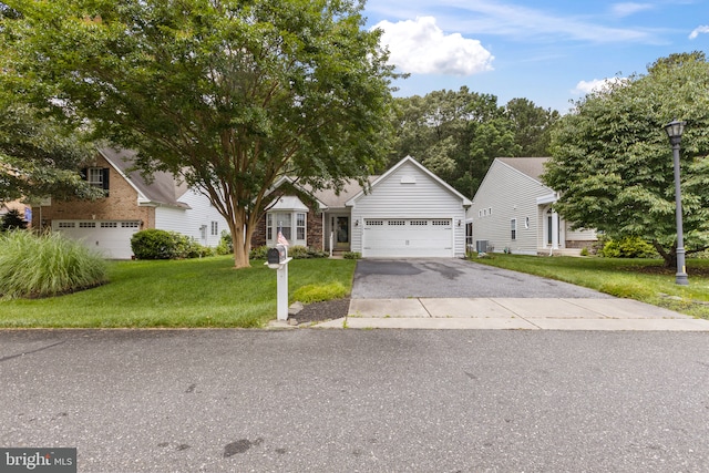 32618 Seaview Loop, Millsboro, DE 19966 - view of front of house featuring a front lawn, driveway, and an attached garage
