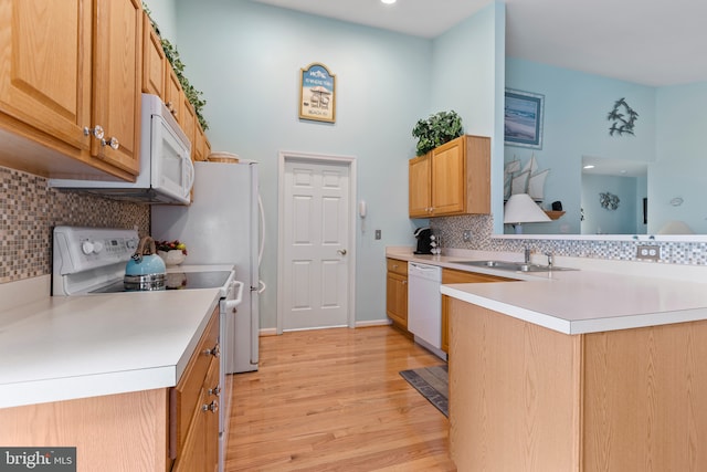 32618 Seaview Loop, Millsboro, DE 19966 - kitchen with white appliances, light wood finished floors, decorative backsplash, light countertops, and a towering ceiling