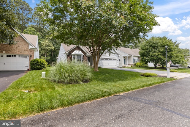 32618 Seaview Loop, Millsboro, DE 19966 - view of property hidden behind natural elements featuring a front lawn and driveway