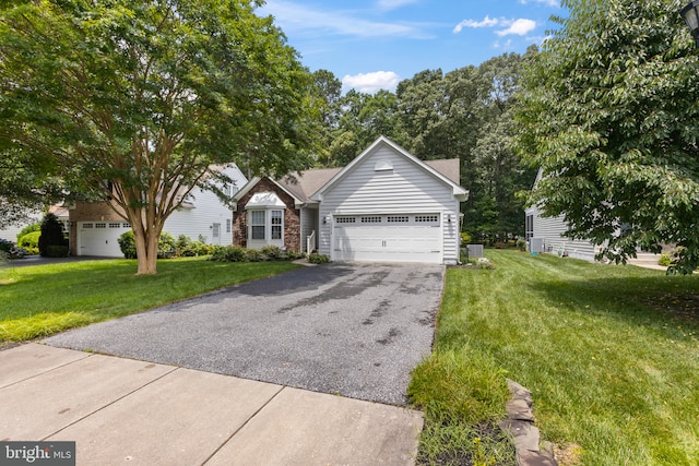 32618 Seaview Loop, Millsboro, DE 19966 - view of front of home featuring driveway, an attached garage, and a front yard